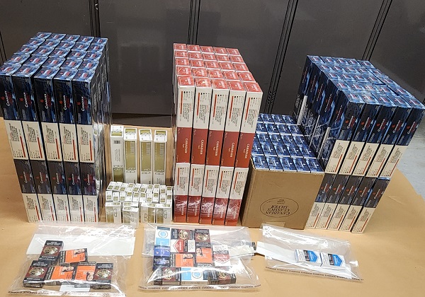 https://www.northshoredailypost.com/wp-content/uploads/2025/08/Contraband-tobacco-products-laid-out-as-exhibits.-The-tobacco-was-suspected-to-be-supplying-an-illegal-store.jpg